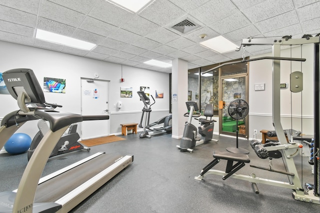 exercise room featuring a drop ceiling