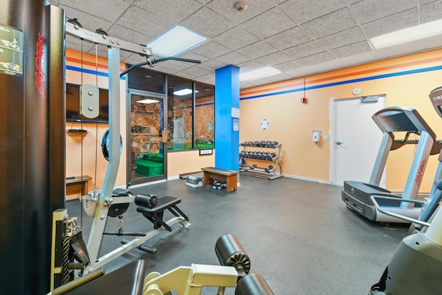 workout area with a paneled ceiling