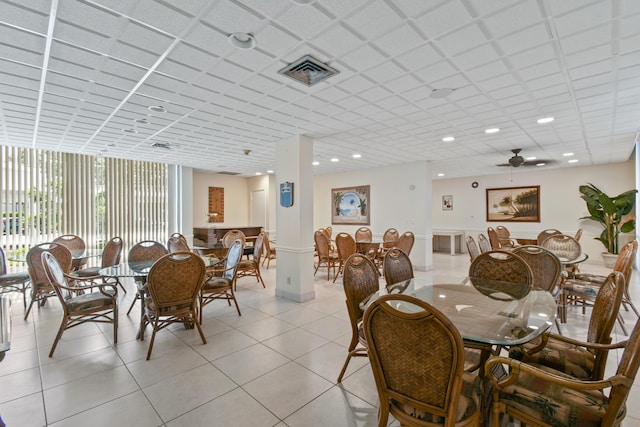 dining room with ceiling fan and light tile patterned floors