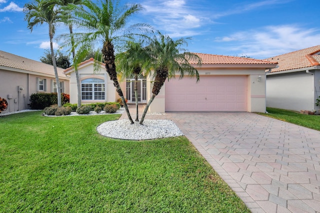 view of front facade with a front lawn and a garage