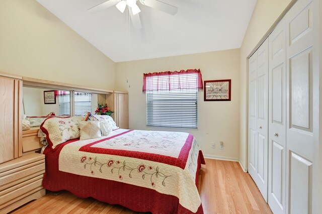 bedroom with ceiling fan, a closet, lofted ceiling, and light hardwood / wood-style flooring