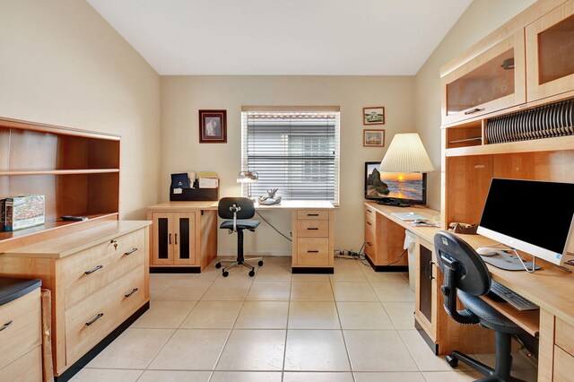 tiled office with vaulted ceiling