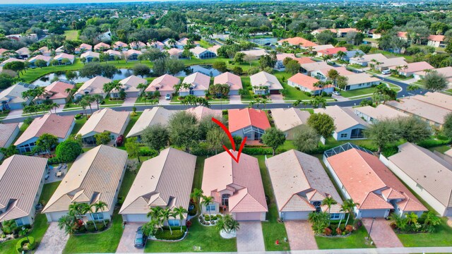 birds eye view of property with a water view