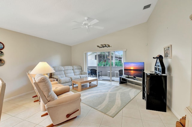 tiled living room featuring ceiling fan and lofted ceiling