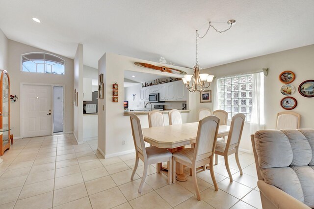 tiled dining space with a notable chandelier