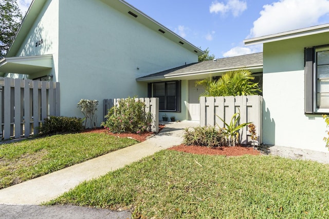 view of property exterior with a lawn