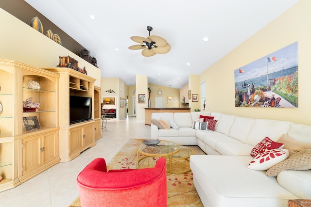 tiled living room featuring vaulted ceiling and ceiling fan