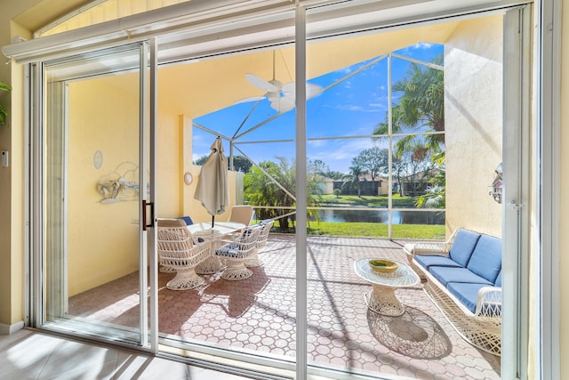 sunroom / solarium with a water view