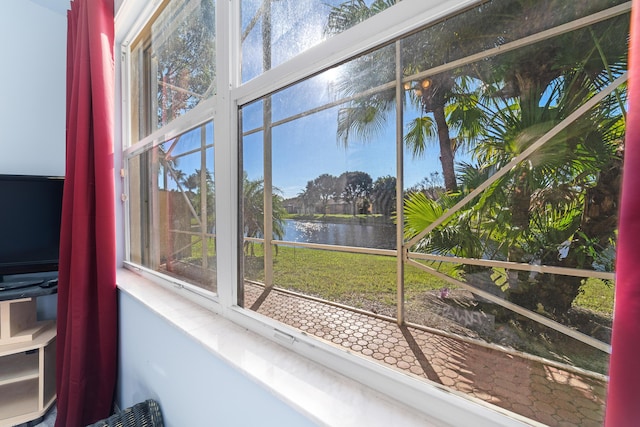 sunroom with a water view