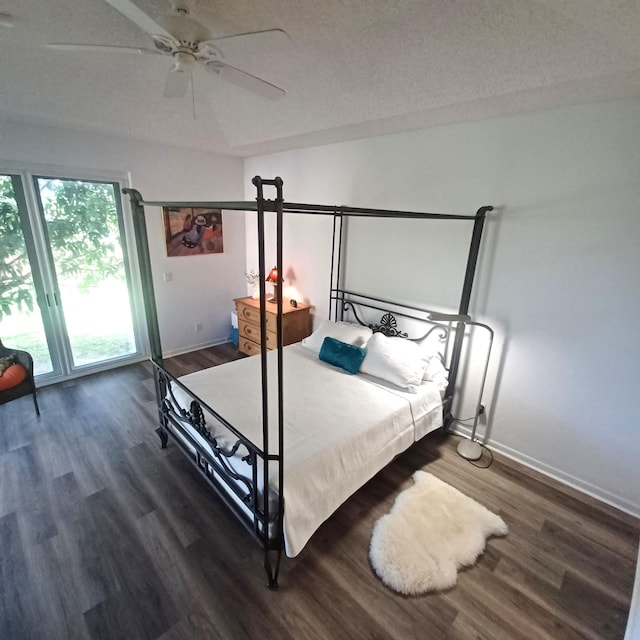 unfurnished bedroom with ceiling fan, dark wood-type flooring, and a textured ceiling