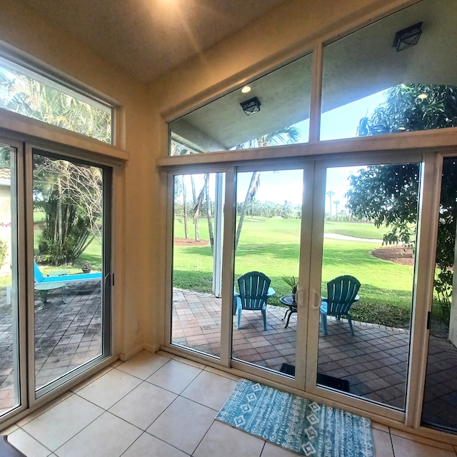 doorway with tile patterned flooring