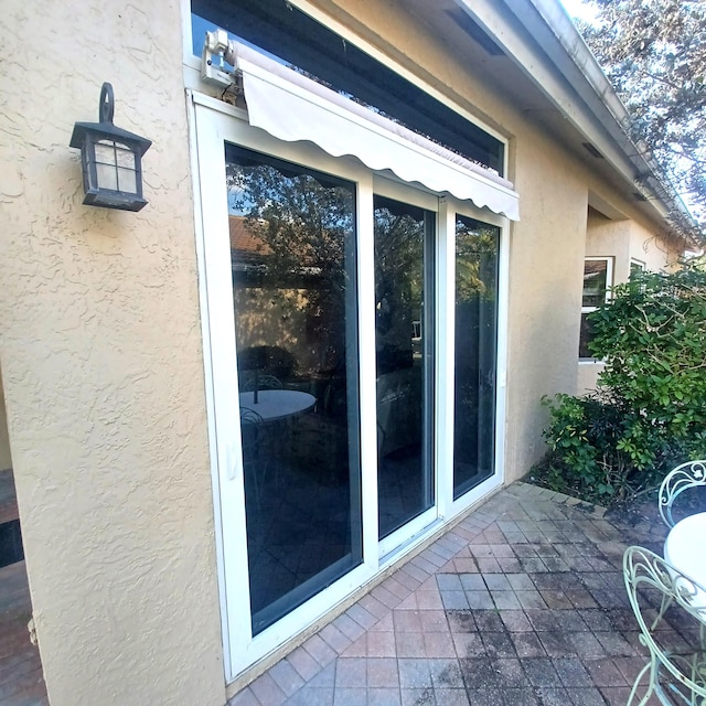 view of side of property featuring a patio