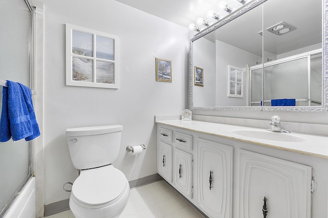 full bathroom featuring vanity, bath / shower combo with glass door, and toilet