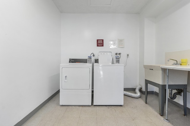 washroom with washer and dryer