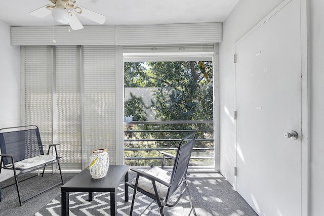 sunroom / solarium featuring ceiling fan and a healthy amount of sunlight