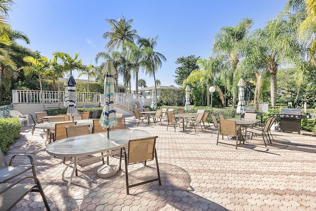 view of patio with a playground and grilling area