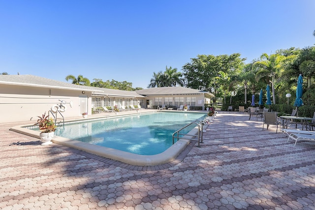 view of swimming pool with a patio