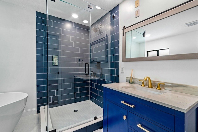 bathroom with vanity and independent shower and bath