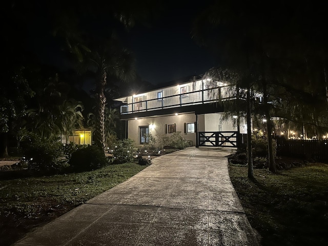 view of front of house with a balcony