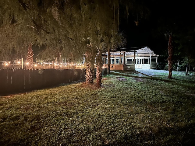 view of yard at night