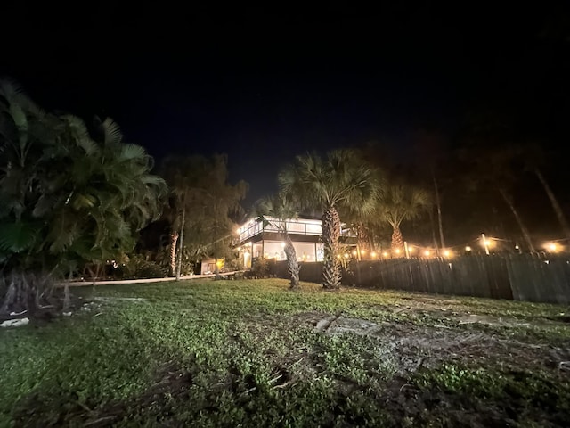 view of yard at twilight