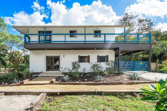 back of house featuring french doors