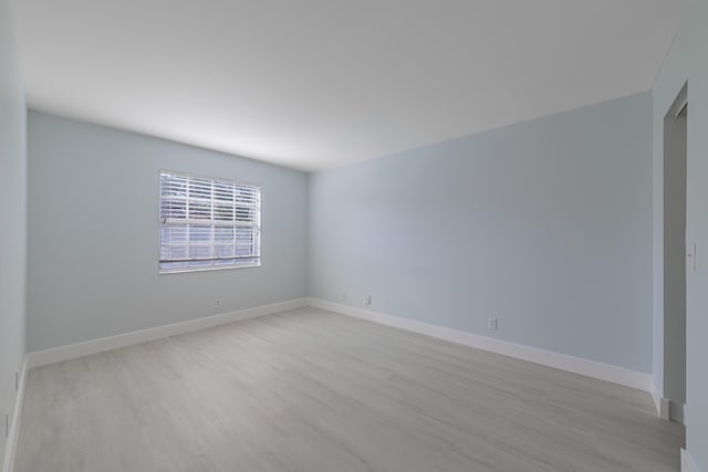 spare room with light wood-type flooring