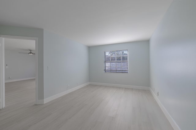 empty room with light hardwood / wood-style floors and ceiling fan