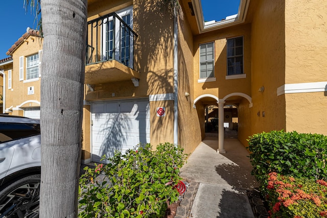 doorway to property featuring a garage