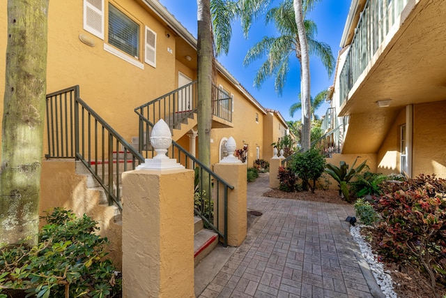 view of side of property with a patio area