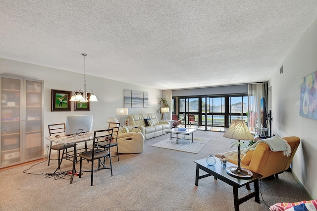 carpeted living room with a textured ceiling and an inviting chandelier