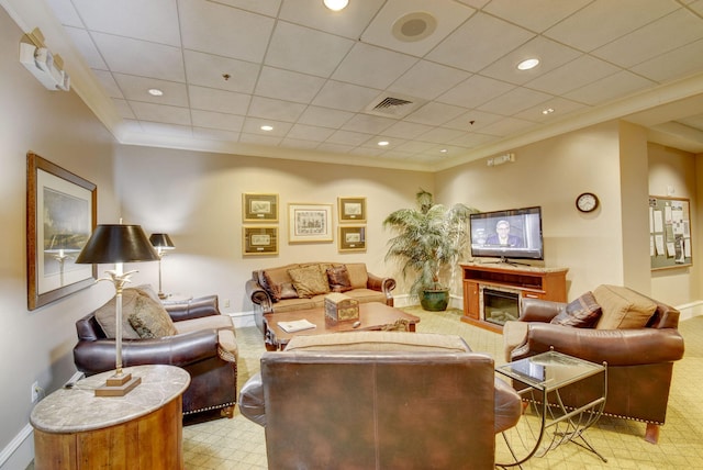 carpeted living room featuring a paneled ceiling and ornamental molding