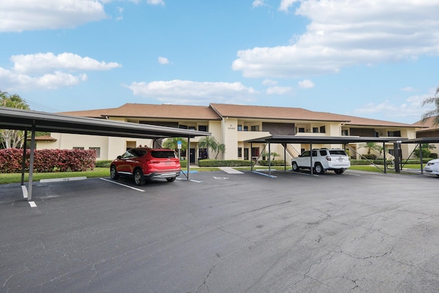 view of parking / parking lot with a carport