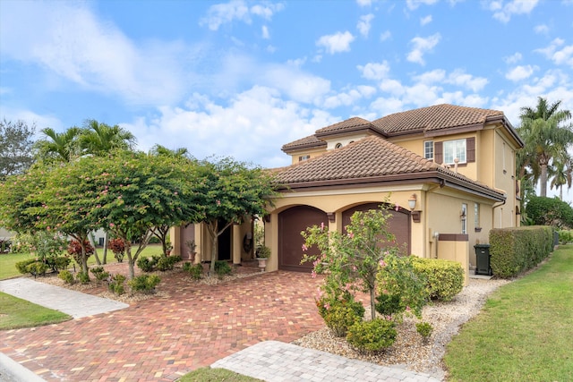 mediterranean / spanish-style home featuring a garage