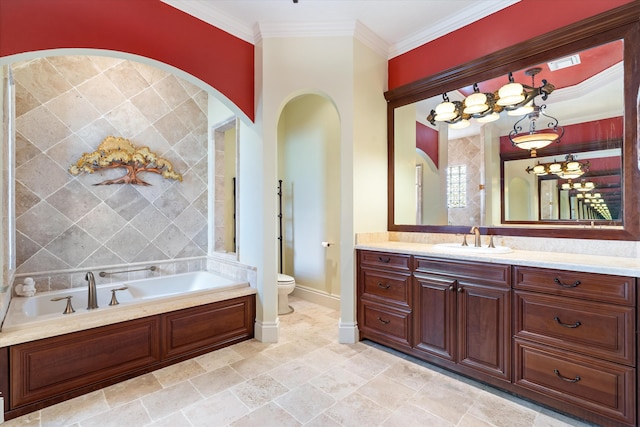 bathroom with ornamental molding, a bathing tub, vanity, and toilet