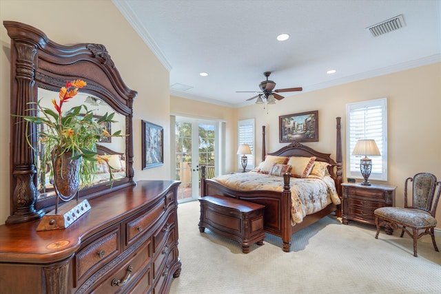 bedroom featuring multiple windows, ornamental molding, light carpet, and access to outside