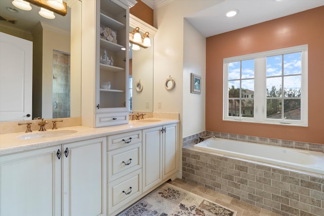 bathroom featuring vanity, ornamental molding, and independent shower and bath