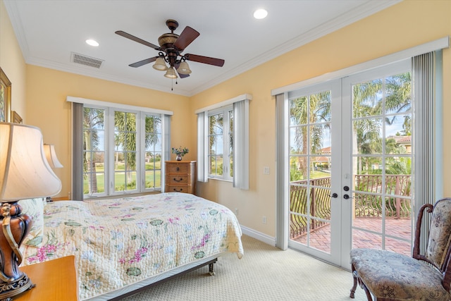 carpeted bedroom with french doors, access to exterior, and crown molding