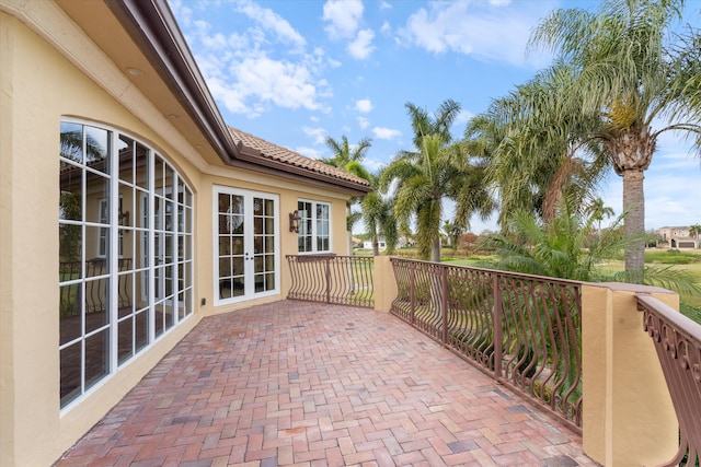 view of patio / terrace with a balcony and french doors