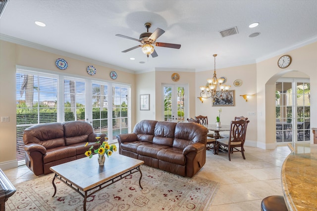 tiled living room featuring crown molding, ceiling fan with notable chandelier, and french doors