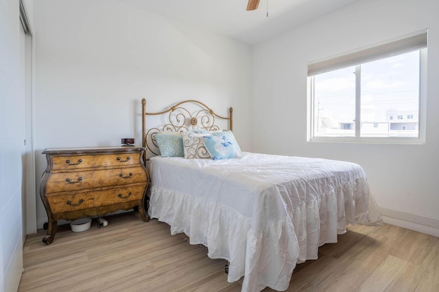 bedroom featuring ceiling fan and light hardwood / wood-style floors