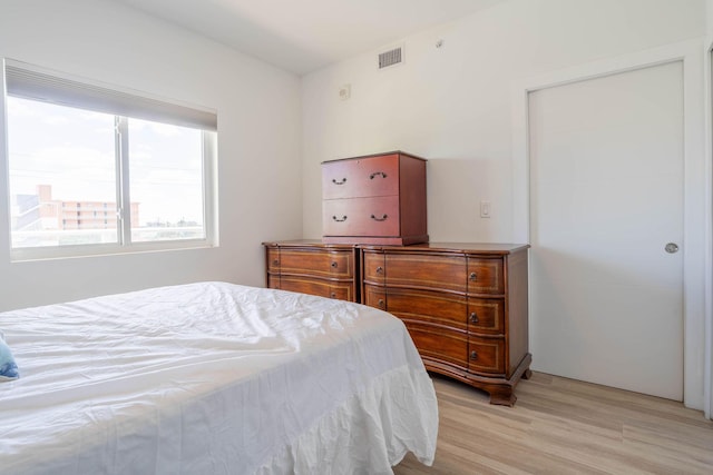 bedroom with light wood-type flooring