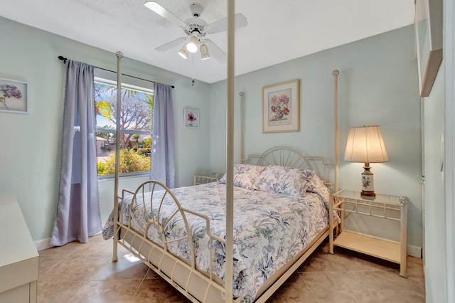 bedroom with tile patterned floors and ceiling fan