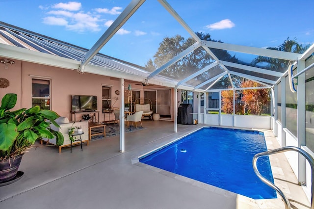 view of pool featuring ceiling fan, a lanai, an outdoor hangout area, and a patio