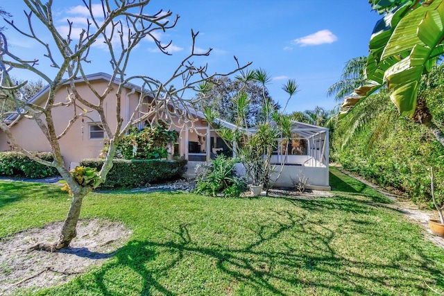 exterior space featuring a lanai and a front yard