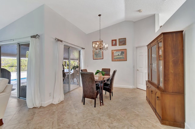 dining area featuring a textured ceiling, vaulted ceiling, a wealth of natural light, and a notable chandelier