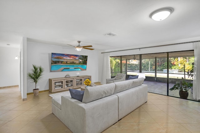 tiled living room featuring ceiling fan