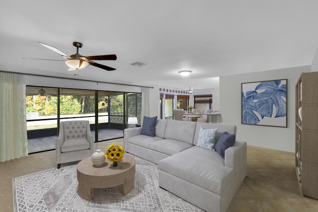 living room featuring ceiling fan and light tile patterned floors