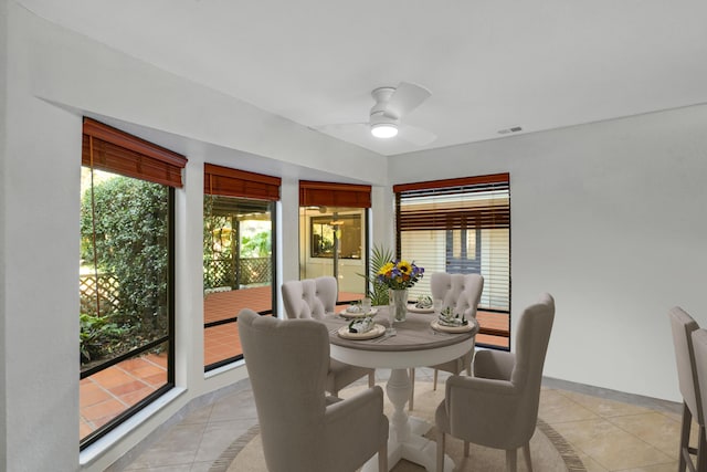 dining room with ceiling fan and light tile patterned floors