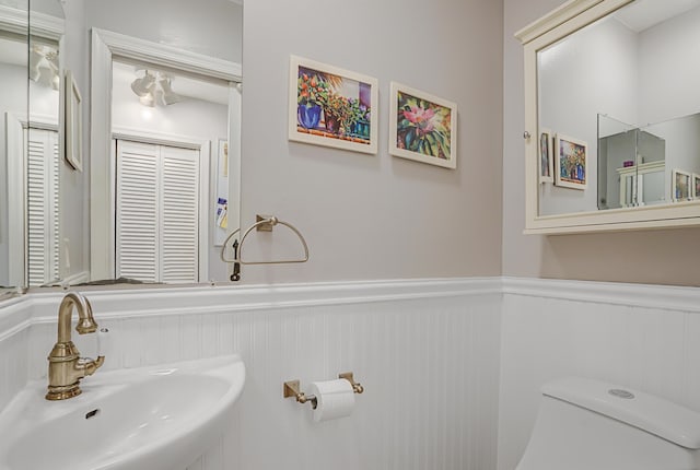 bathroom featuring sink and toilet